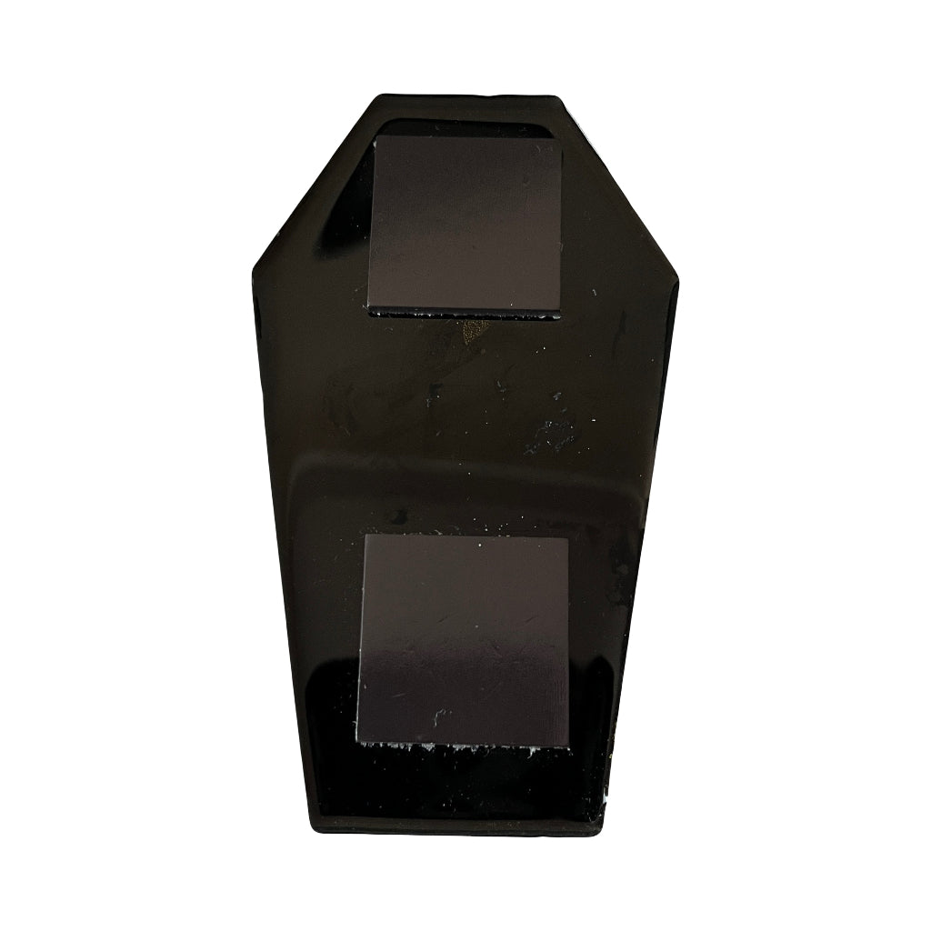 Coffin Shaped Fridge Magnets - Back of a glossy black coffin-shaped object with two large square magnets, shown against a plain white background.