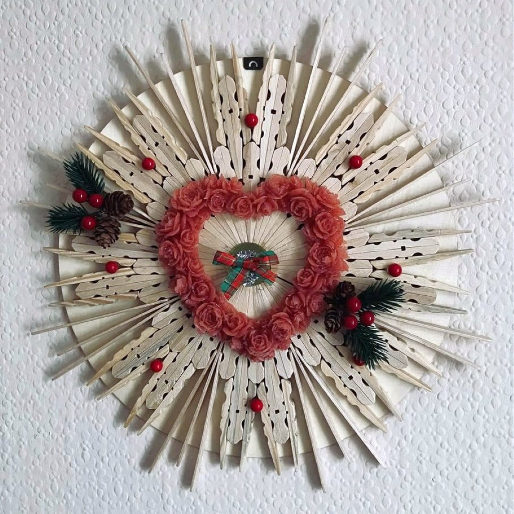 Wooden Christmas Wreath Handmade wall art featuring a heart shape adorned with flowers and holly berries.