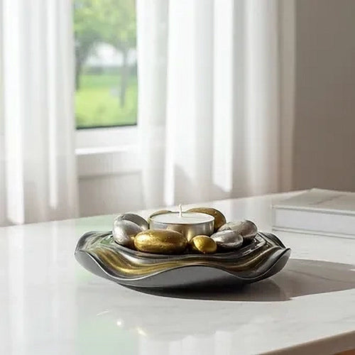 Decorative Candle Holder Plate with metallic elements on a table in a bright room