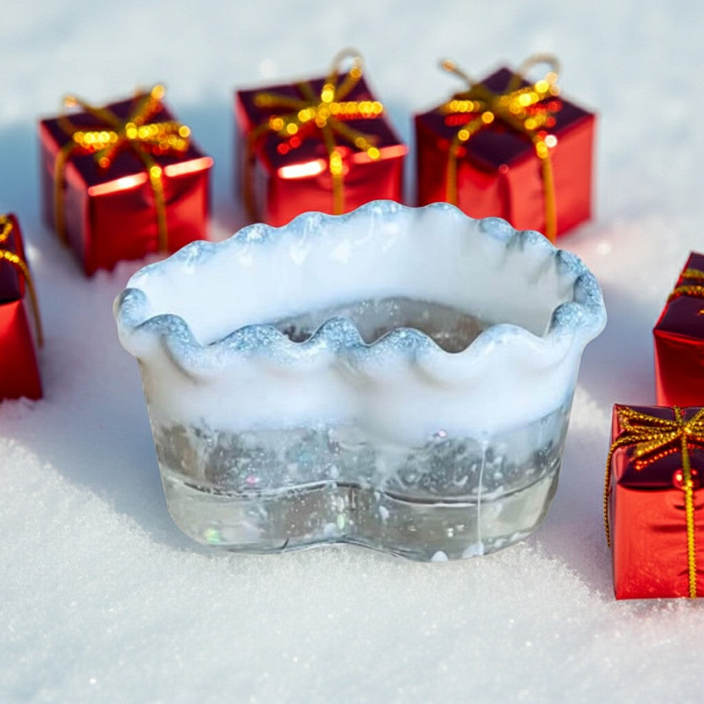 Heart Shaped Trinket Jar - Back view of a clear resin pot with a scalloped white frosted rim sits in snow, surrounded by small red gift boxes with gold ribbons.